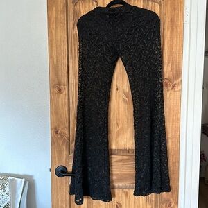 Beautiful black fitted and flared net see-through pants with shorts underneath